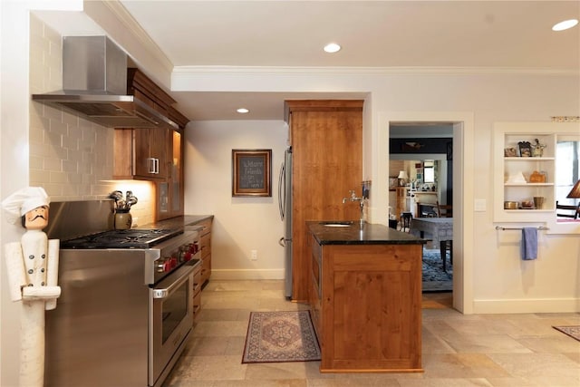 kitchen with sink, stainless steel appliances, wall chimney range hood, tasteful backsplash, and crown molding