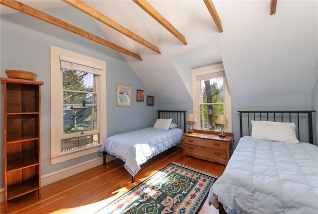 bedroom with hardwood / wood-style floors and vaulted ceiling