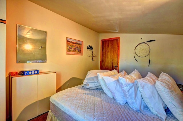 bedroom featuring vaulted ceiling