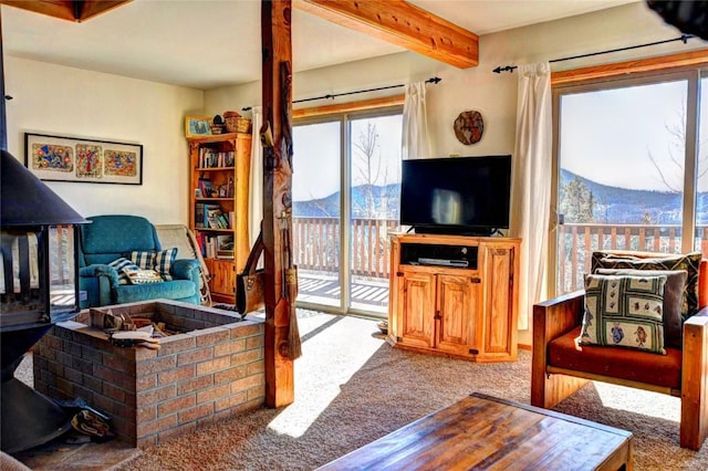 living room featuring carpet flooring and beam ceiling