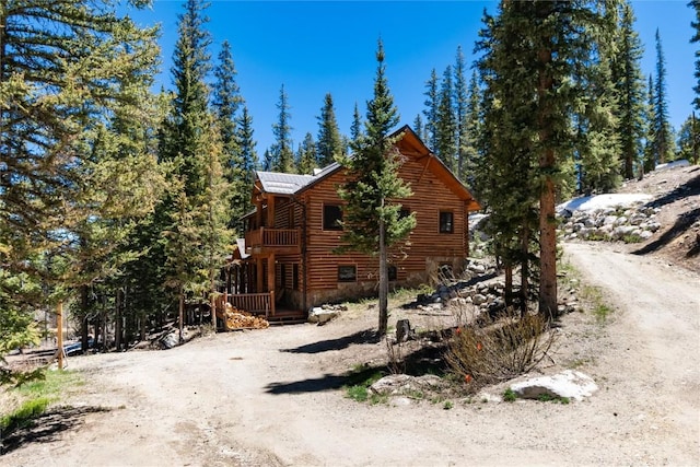 view of side of home featuring a wooden deck