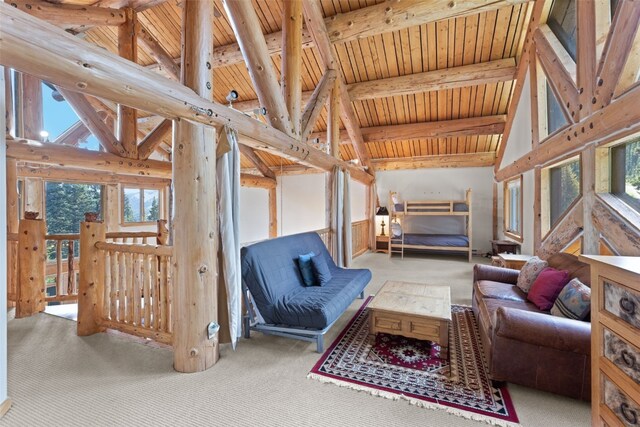 interior space with lofted ceiling with beams and wooden ceiling