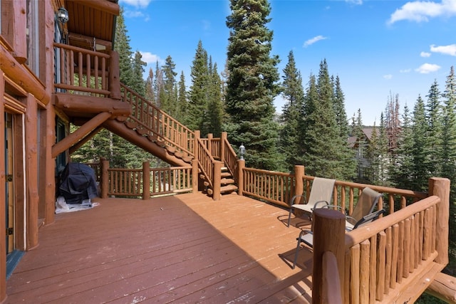 wooden terrace featuring grilling area