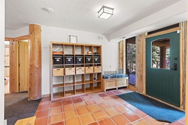 mudroom with tile patterned flooring