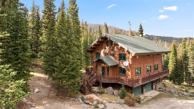 view of home's exterior featuring a mountain view and a garage