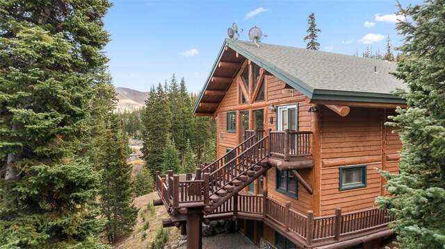 back of property featuring a mountain view