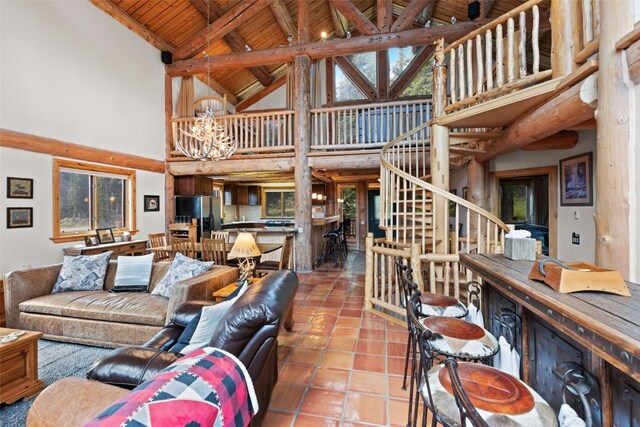 living room featuring high vaulted ceiling, tile patterned floors, beamed ceiling, wood ceiling, and a chandelier