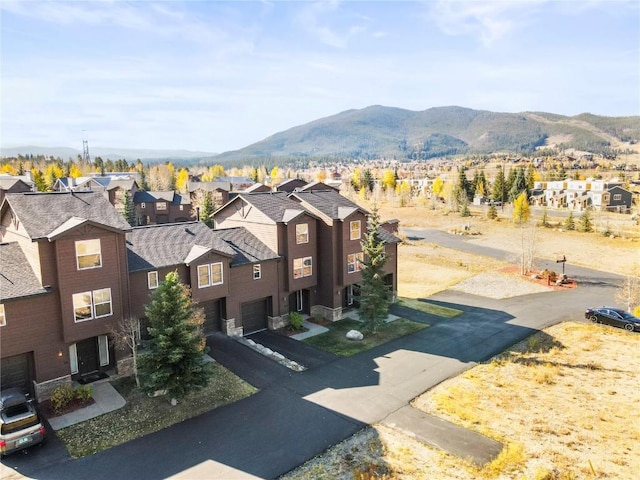 birds eye view of property with a mountain view