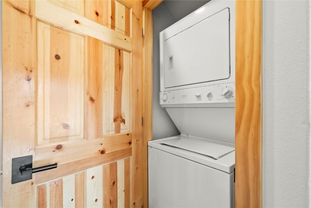 laundry area featuring stacked washing maching and dryer