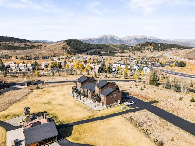 birds eye view of property featuring a mountain view