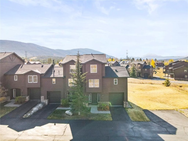 view of front of house with a mountain view and a garage