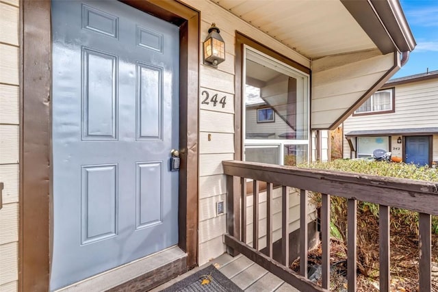 view of exterior entry with covered porch