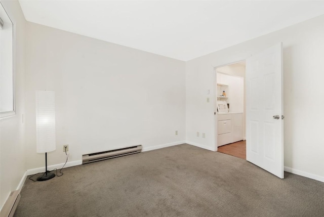 spare room featuring baseboard heating and carpet floors