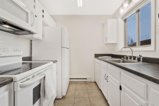 kitchen featuring white appliances, a baseboard heating unit, sink, light tile patterned floors, and white cabinets