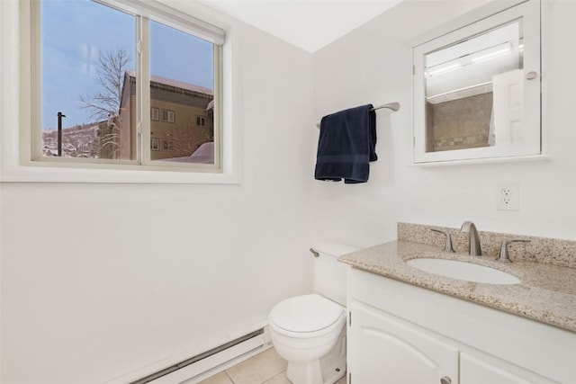 bathroom with vanity, a baseboard heating unit, a shower, tile patterned flooring, and toilet