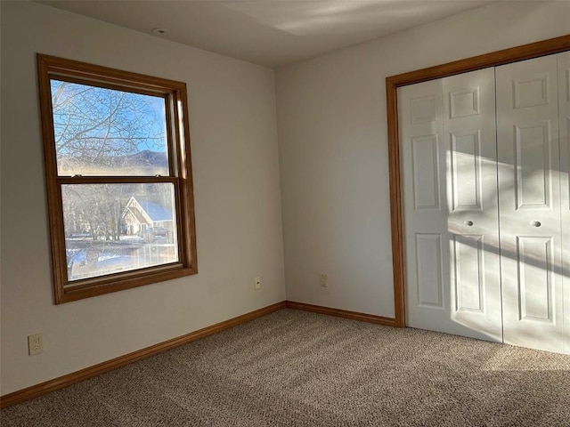 unfurnished room with carpet