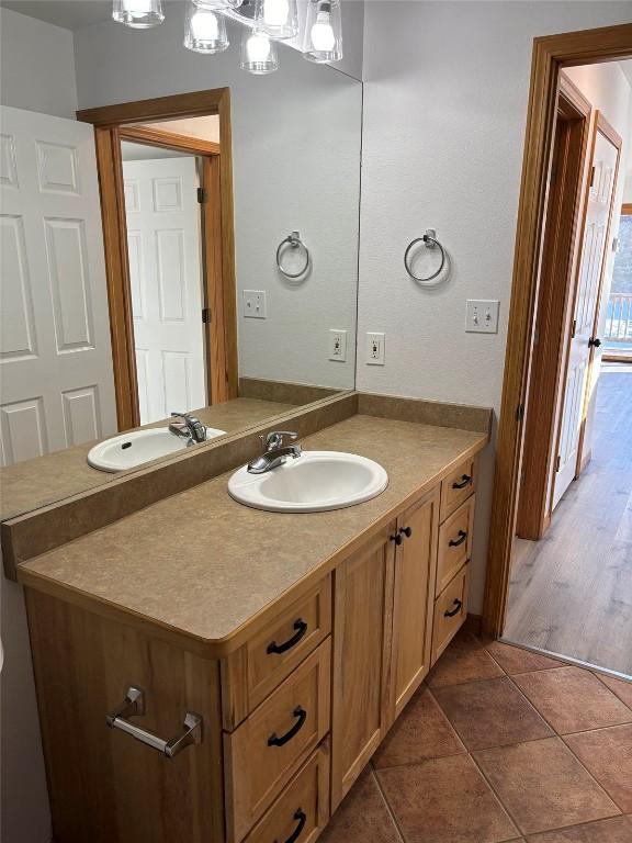 bathroom with tile patterned floors and vanity