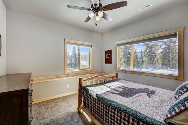 carpeted bedroom with ceiling fan