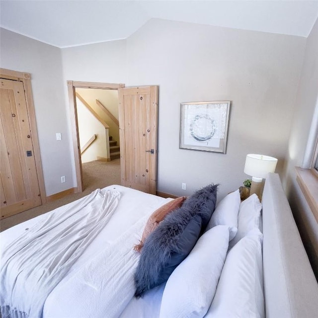 bedroom featuring vaulted ceiling