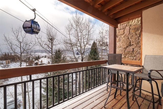 view of snow covered deck