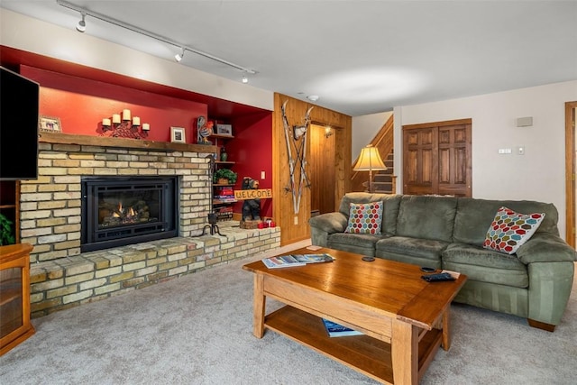 carpeted living room featuring a fireplace