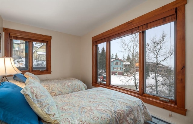 bedroom with a baseboard heating unit