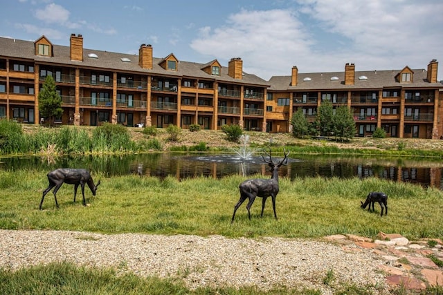 view of home's community with a water view