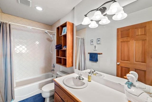 full bathroom with vanity, toilet, shower / bath combo with shower curtain, and a notable chandelier