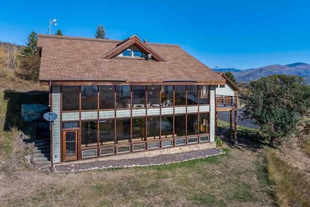 back of house with a mountain view