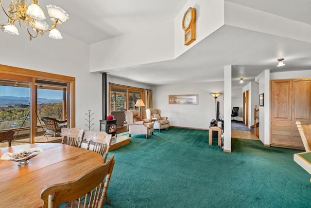 carpeted dining space with an inviting chandelier and a wood stove