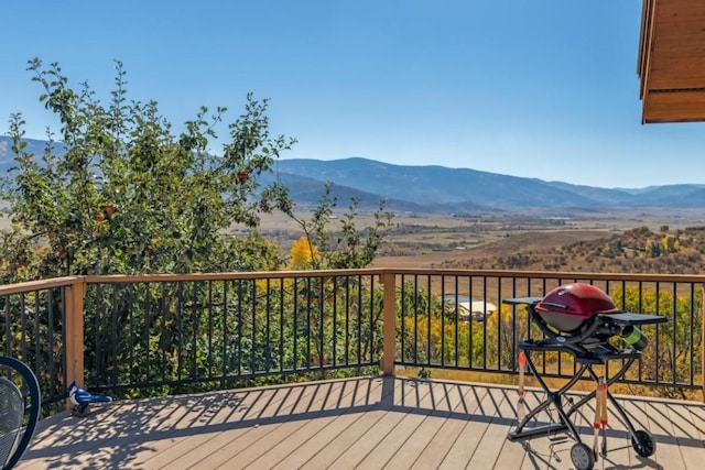 wooden terrace featuring a mountain view