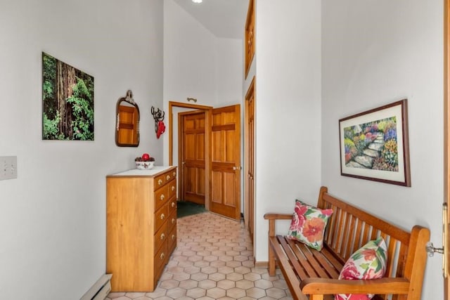 hallway featuring a high ceiling