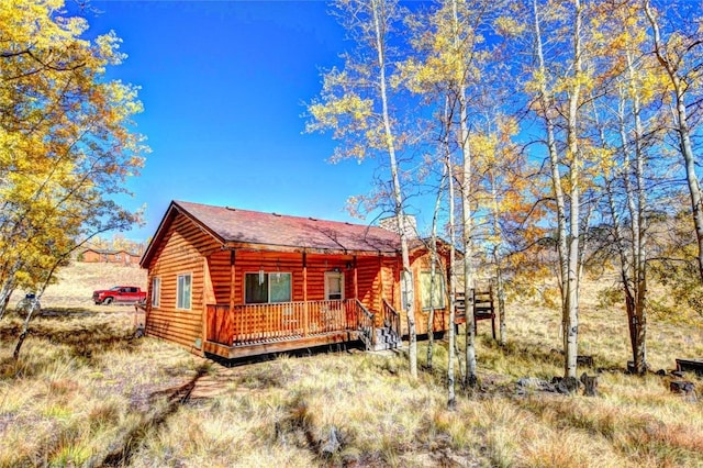 rear view of property with a deck