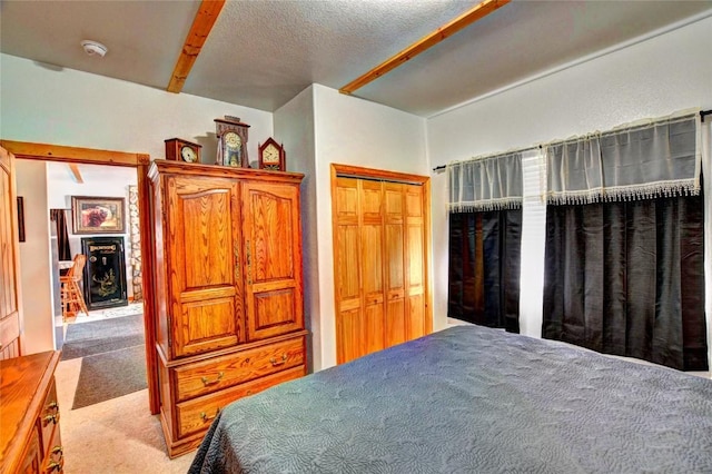 bedroom with a closet and light colored carpet