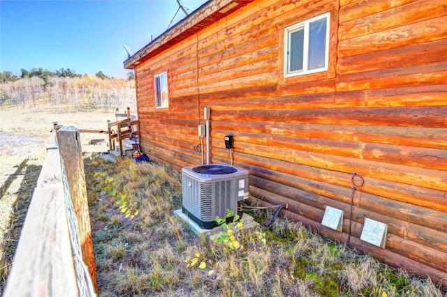 view of side of home with cooling unit