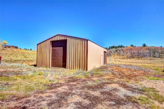 view of outdoor structure featuring a rural view