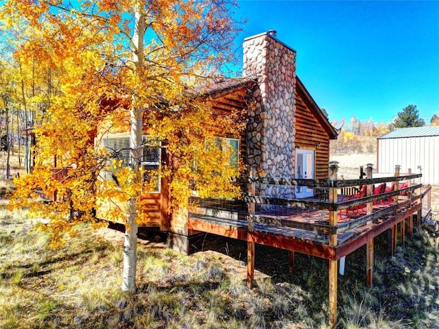 view of property exterior featuring a deck