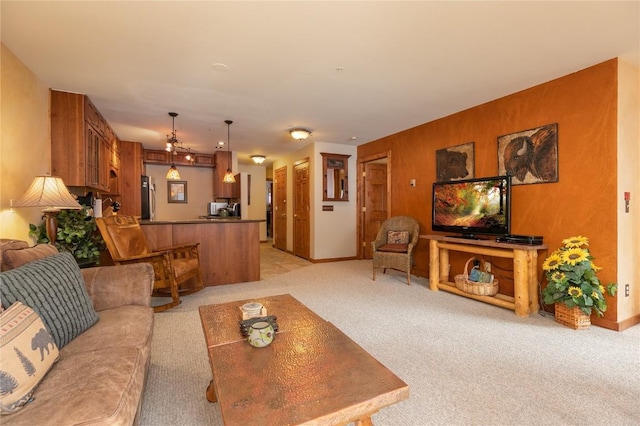 carpeted living room featuring wooden walls