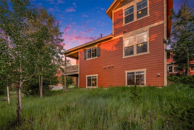 view of back house at dusk