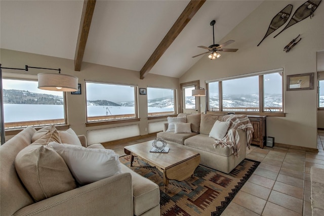 living room featuring light tile patterned floors, high vaulted ceiling, beam ceiling, and a healthy amount of sunlight