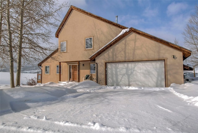 view of front facade featuring stucco siding and an attached garage