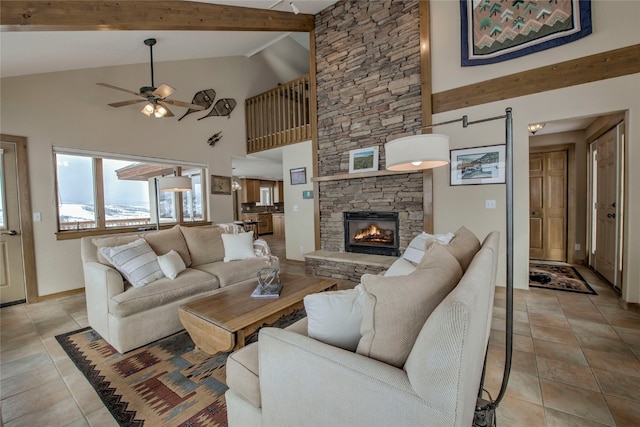 living area featuring light tile patterned floors, ceiling fan, high vaulted ceiling, a fireplace, and beamed ceiling