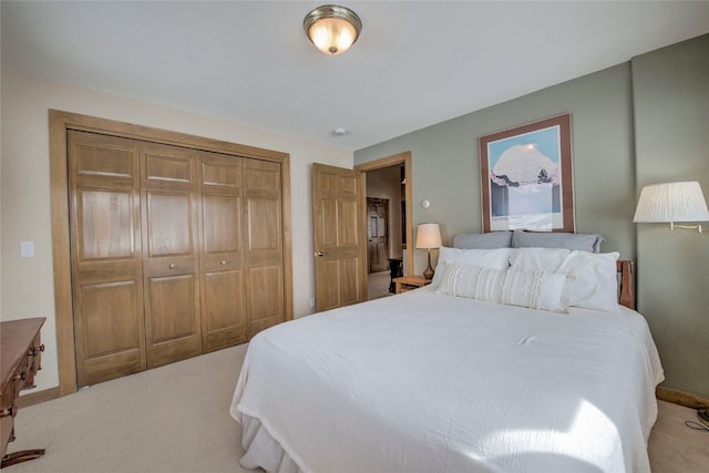 bedroom with light carpet and a closet