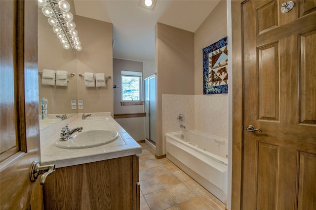 bathroom with a sink, a bath, and a shower stall