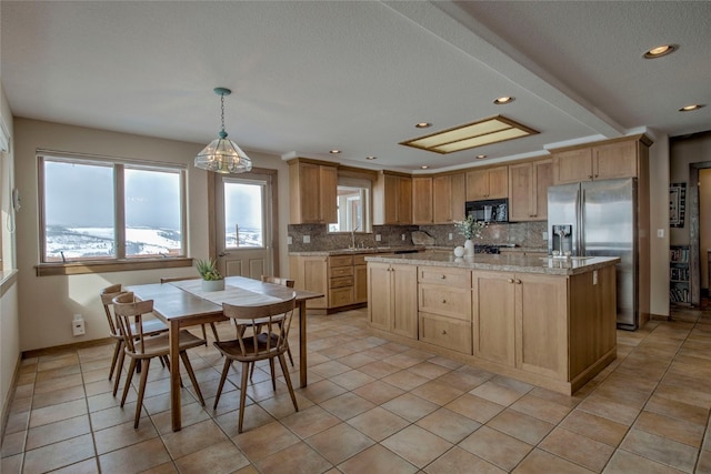 kitchen with black microwave, light brown cabinets, stainless steel refrigerator with ice dispenser, and backsplash