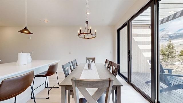 dining space featuring a chandelier and light wood-type flooring