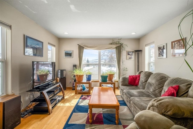 living room featuring recessed lighting and light wood-style floors