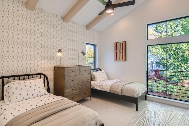 bedroom with carpet, vaulted ceiling with beams, and ceiling fan