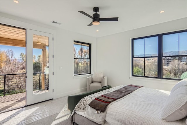 bedroom with ceiling fan and access to exterior