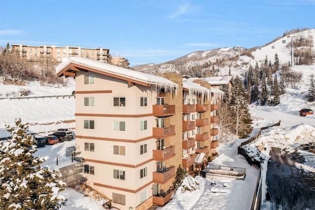 snow covered building with a mountain view